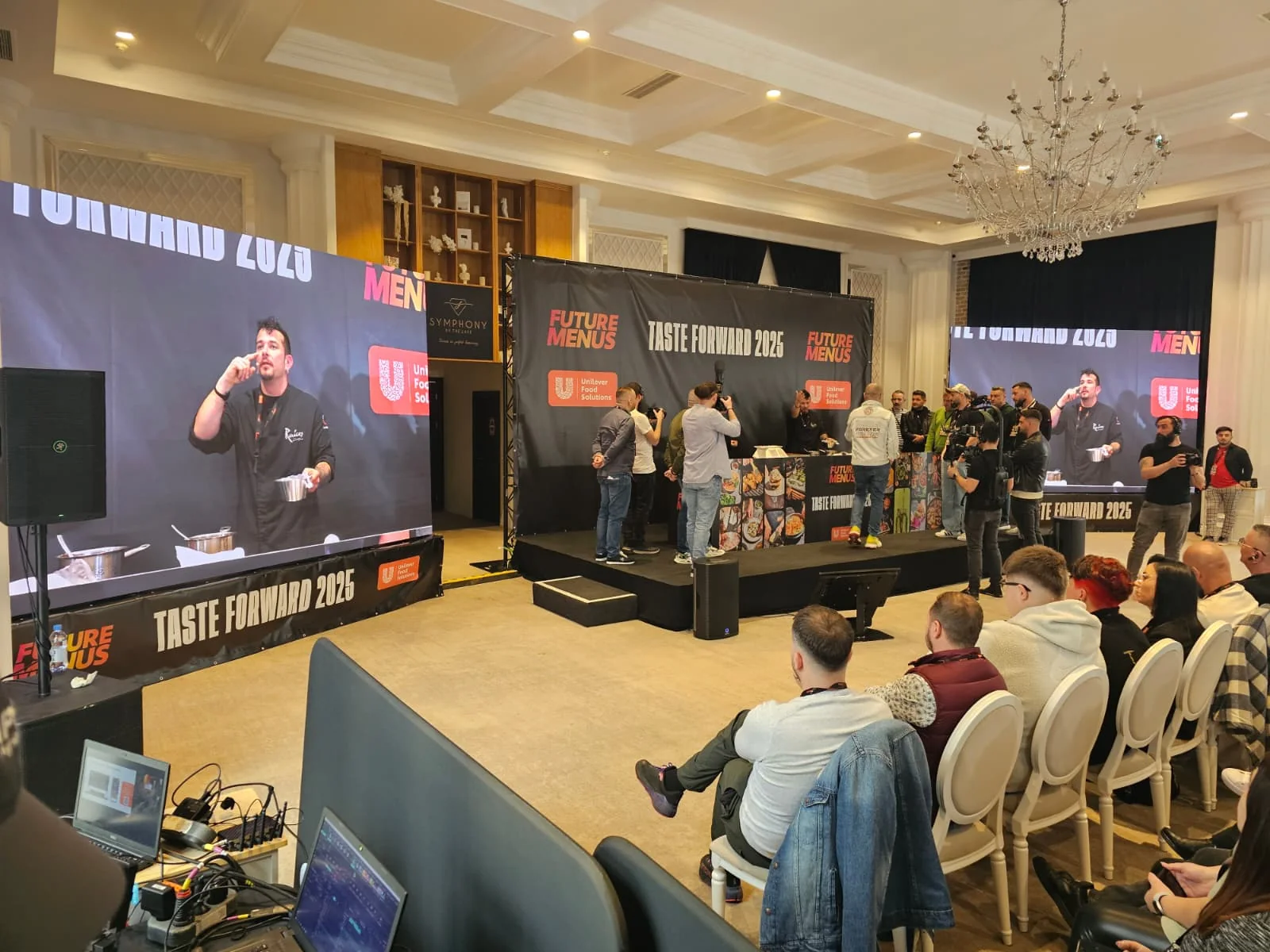 UniChef Cup 2025 stage with LED displays and audience during the Sibiu event.