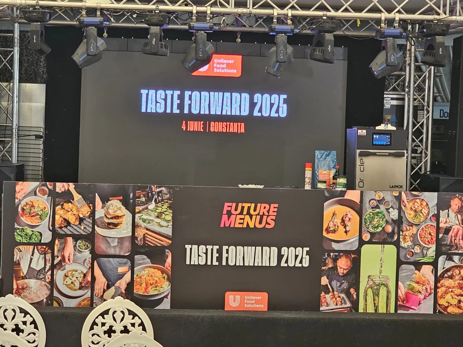 UniChef Cup 2025 stage in Mamaia with branded visual content and event seating.