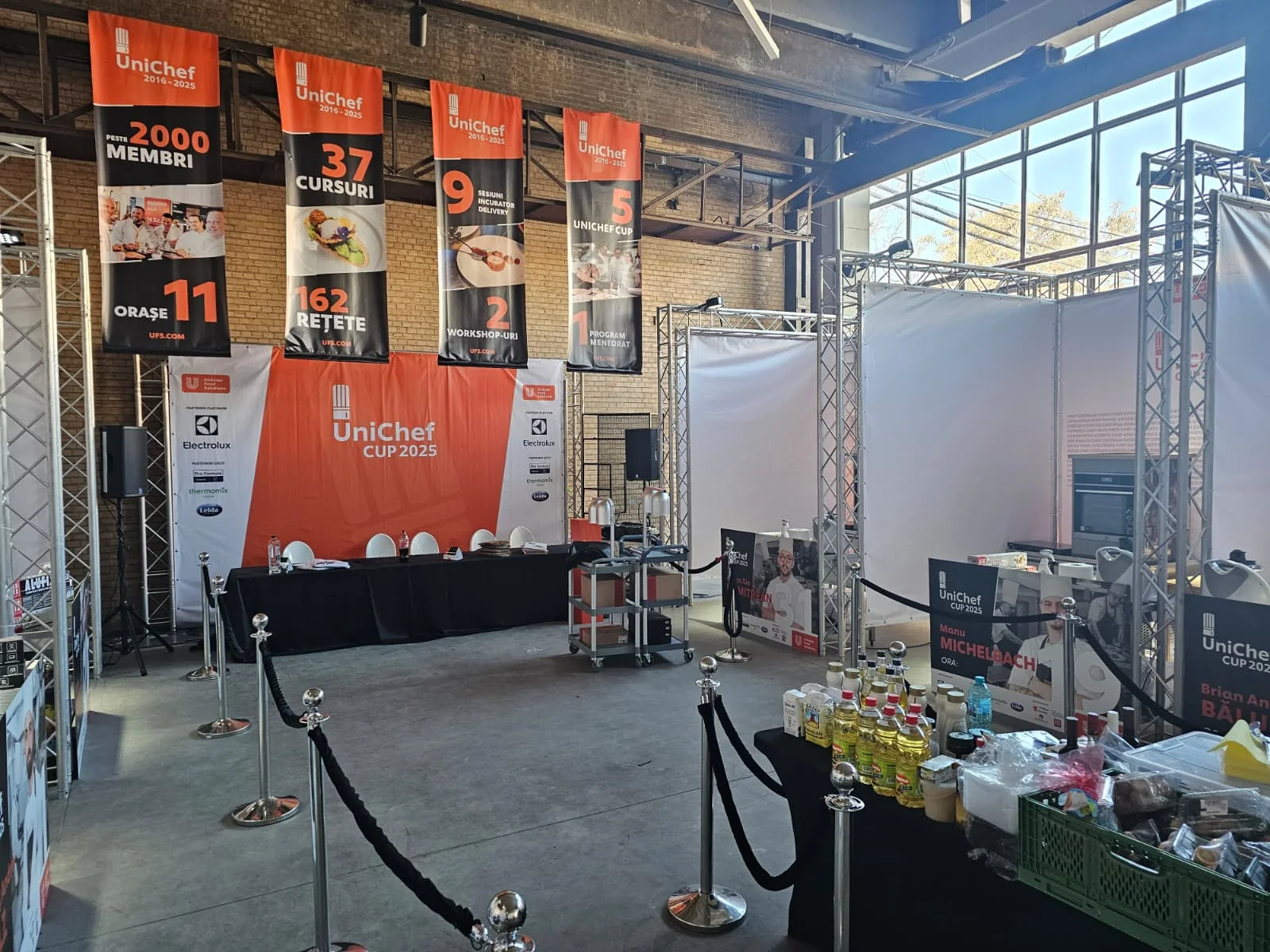 UniChef Cup 2025 event production area in Bucharest with stage, displays and technical equipment.