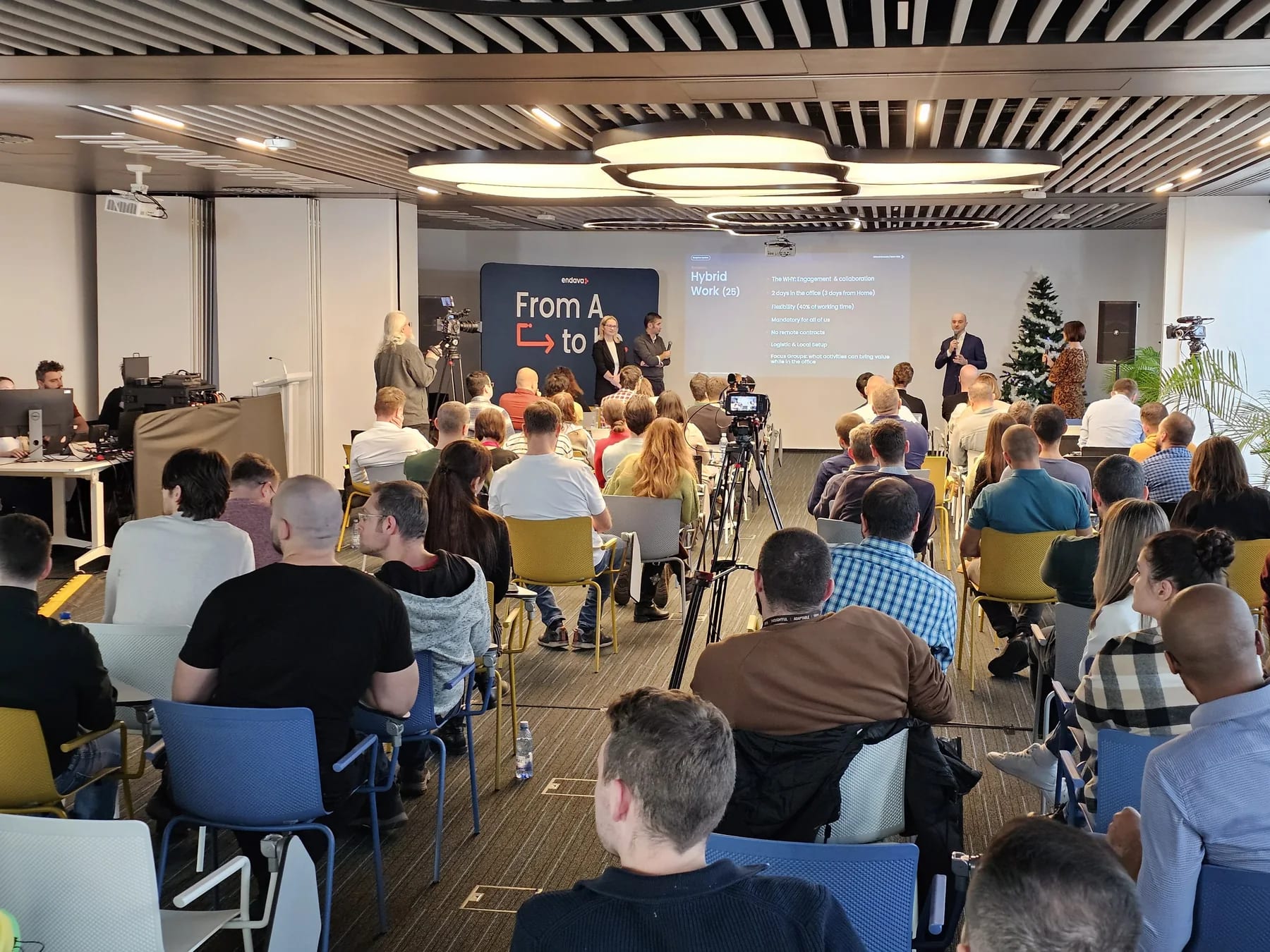 Endava internal event at U Center in Bucharest with presentation screen, audience and stage area.