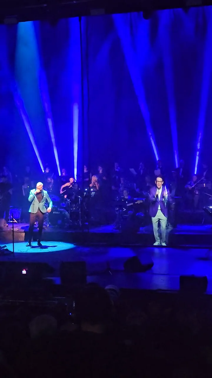 Gabriel Cotabita tribute performance at TNB under blue stage lighting during the holographic presentation.