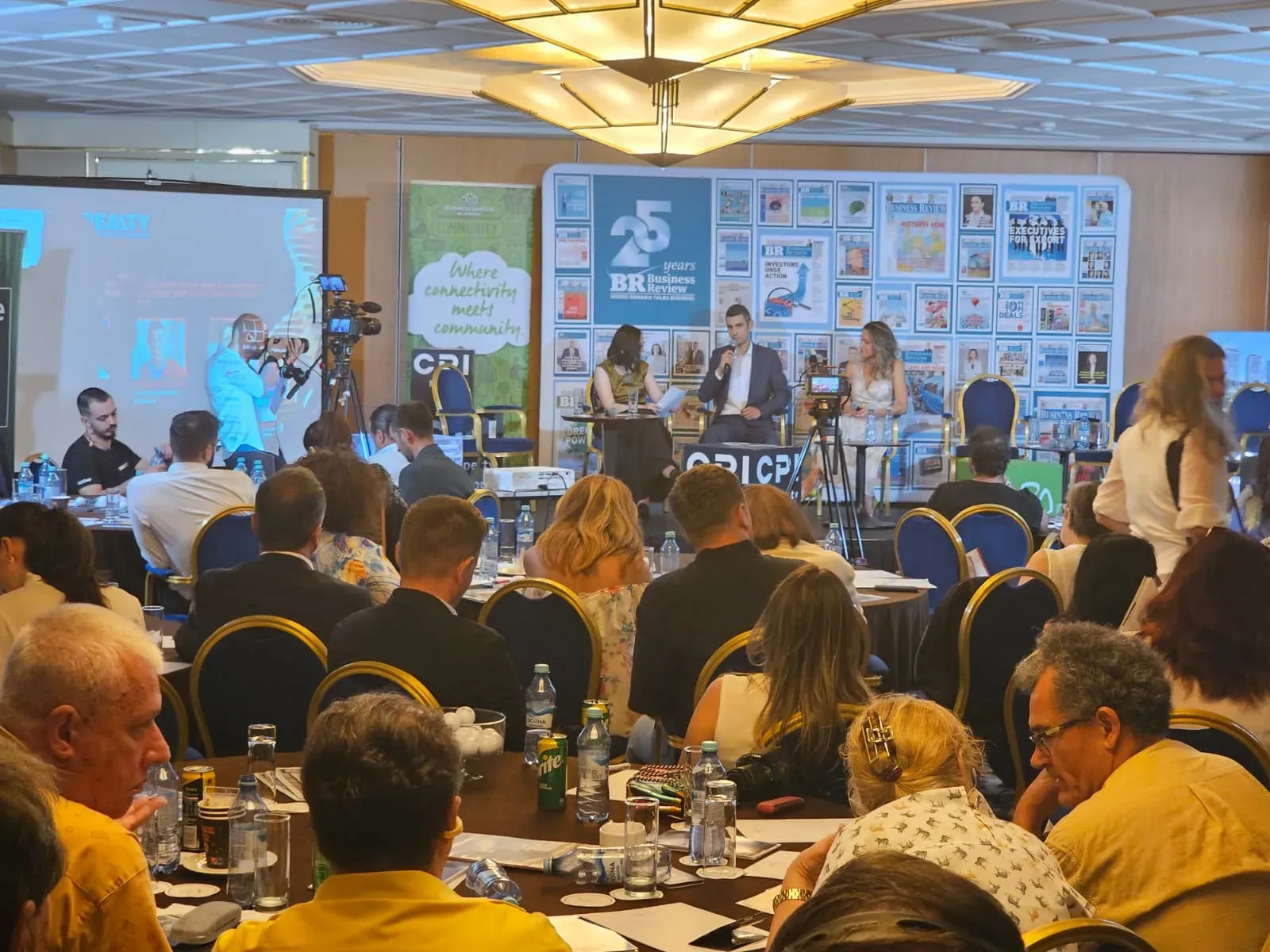 Business Review panel discussion on stage during the conference at Crowne Plaza in Bucharest.