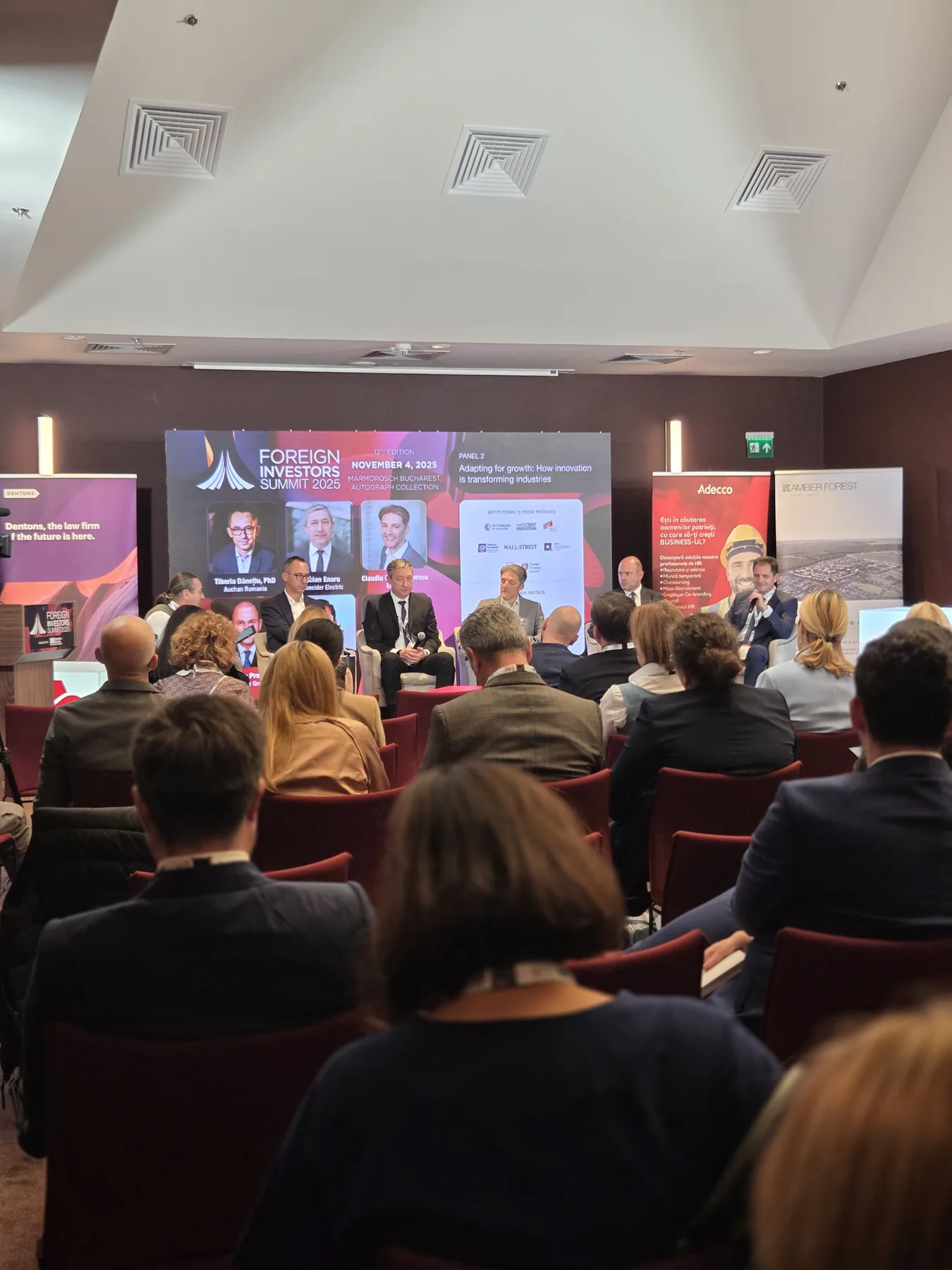 Panel session on stage during the Business Review Foreign Investors Summit 2025 at Hotel Marmorosch in Bucharest.