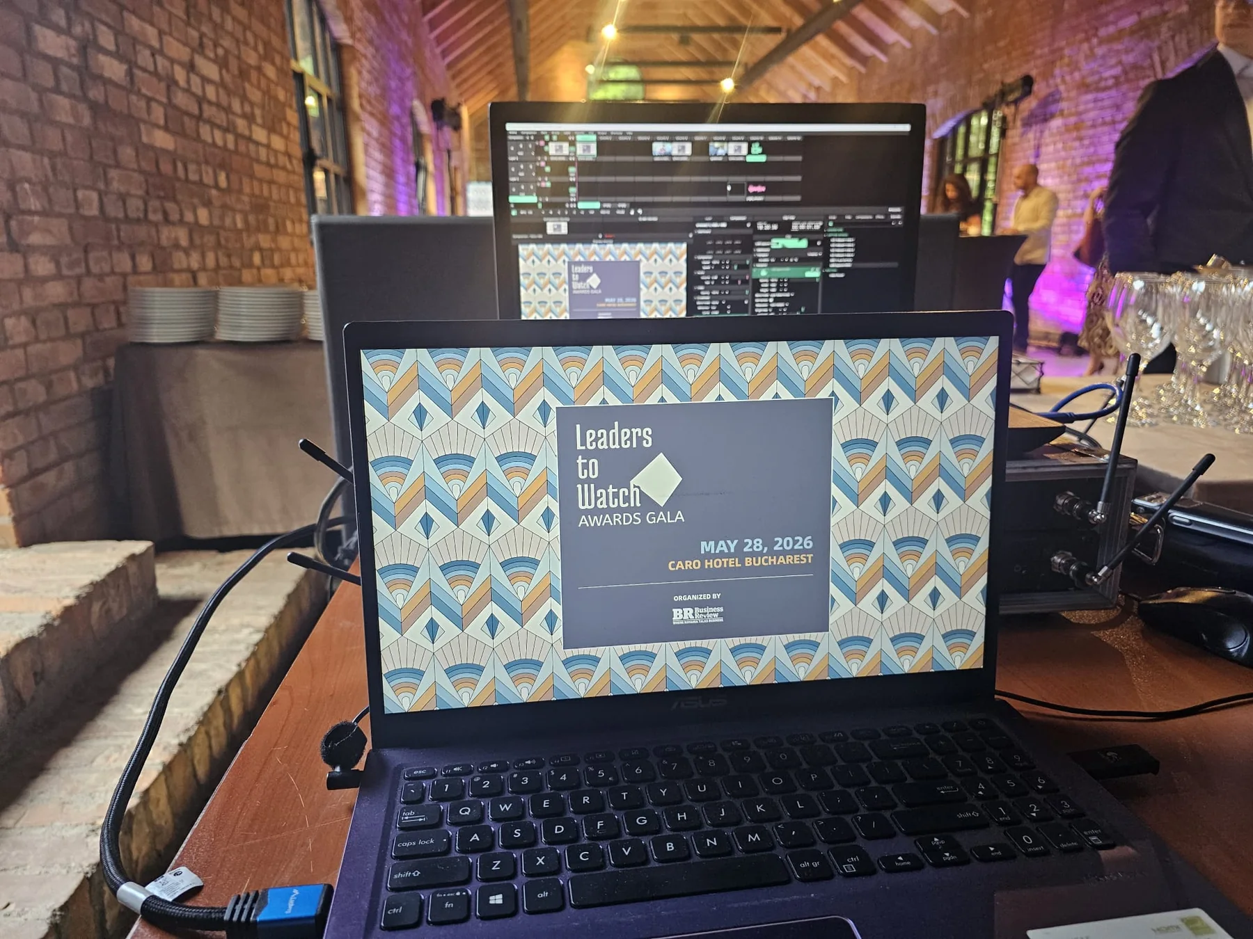 Laptop and presentation-control setup used for the Business Review production at Caro Atelier in Bucharest.