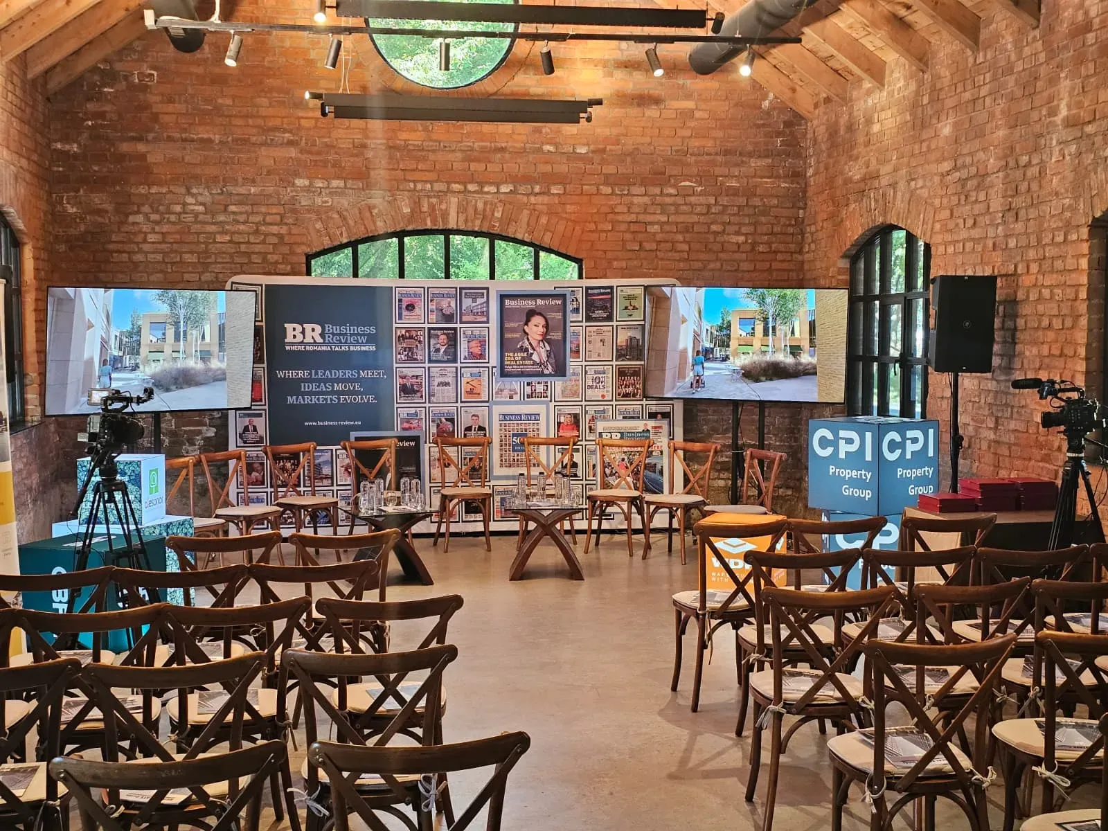 Conference seating and display setup prepared for the live-streamed Business Review event at Caro Atelier.
