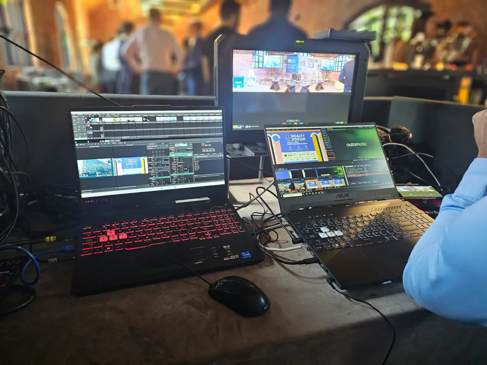 Live-streaming and video-control laptops operating the Business Review conference at Caro Atelier in Bucharest.
