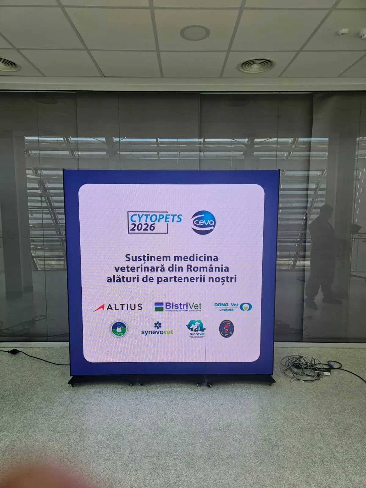 Digital poster display installed for the CEVA Cytopets 2026 event at Synevo Lab in Chiajna.