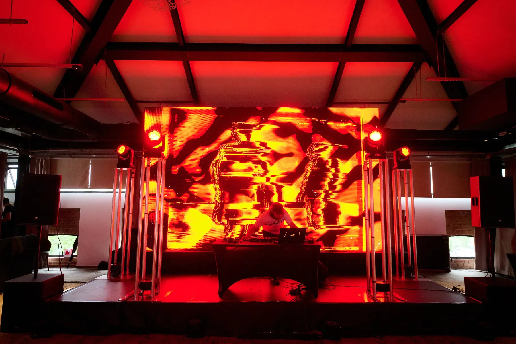 LED screen and stage production illuminated in red during the Avon gala at Conacul Cozieni in Cozieni.