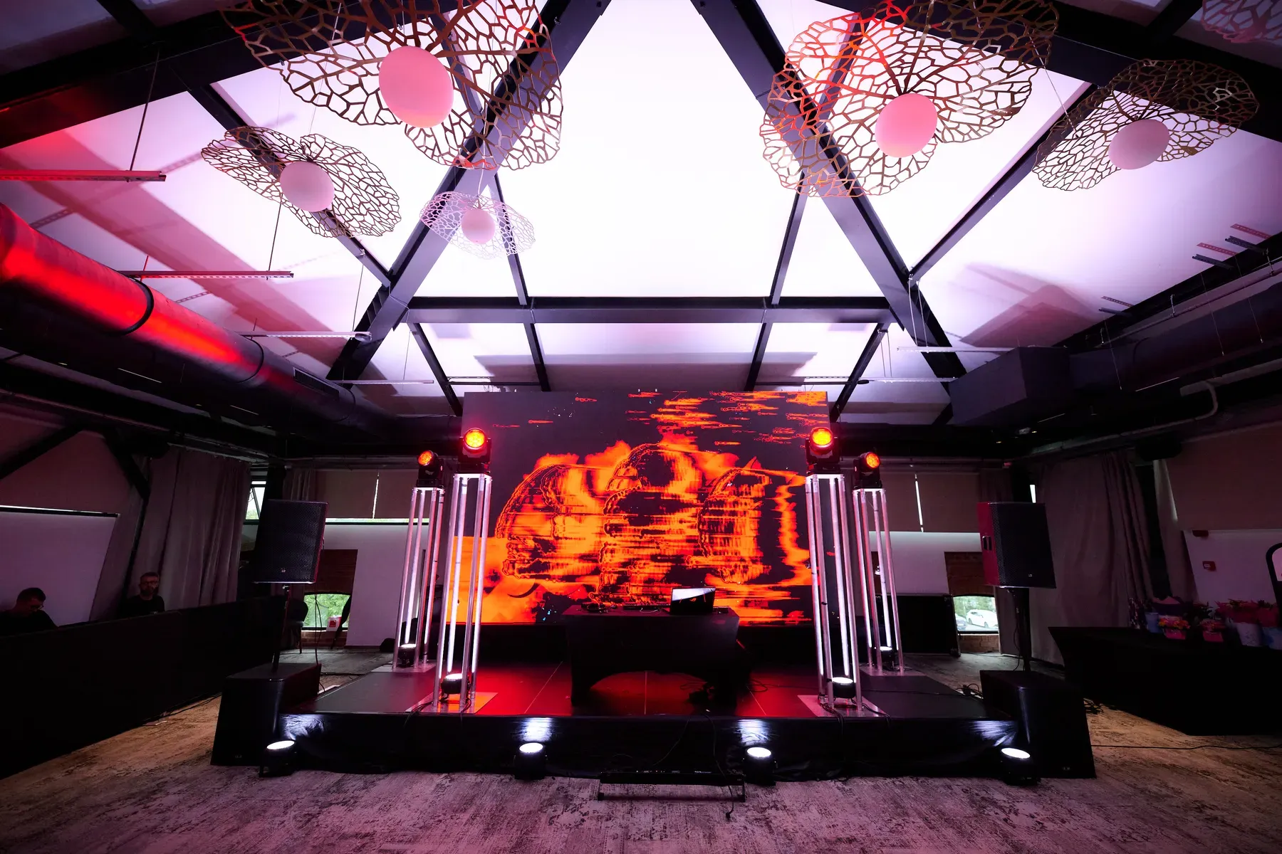 Avon gala stage with LED screen, truss structures and red event lighting at Conacul Cozieni in Cozieni.