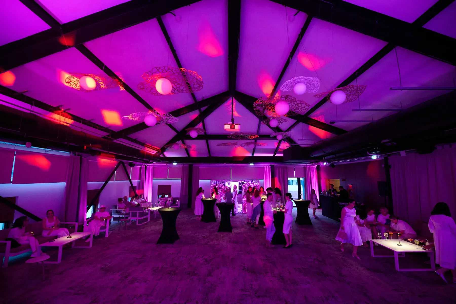 Avon gala venue with magenta ambient lighting and event seating at Conacul Cozieni in Cozieni.