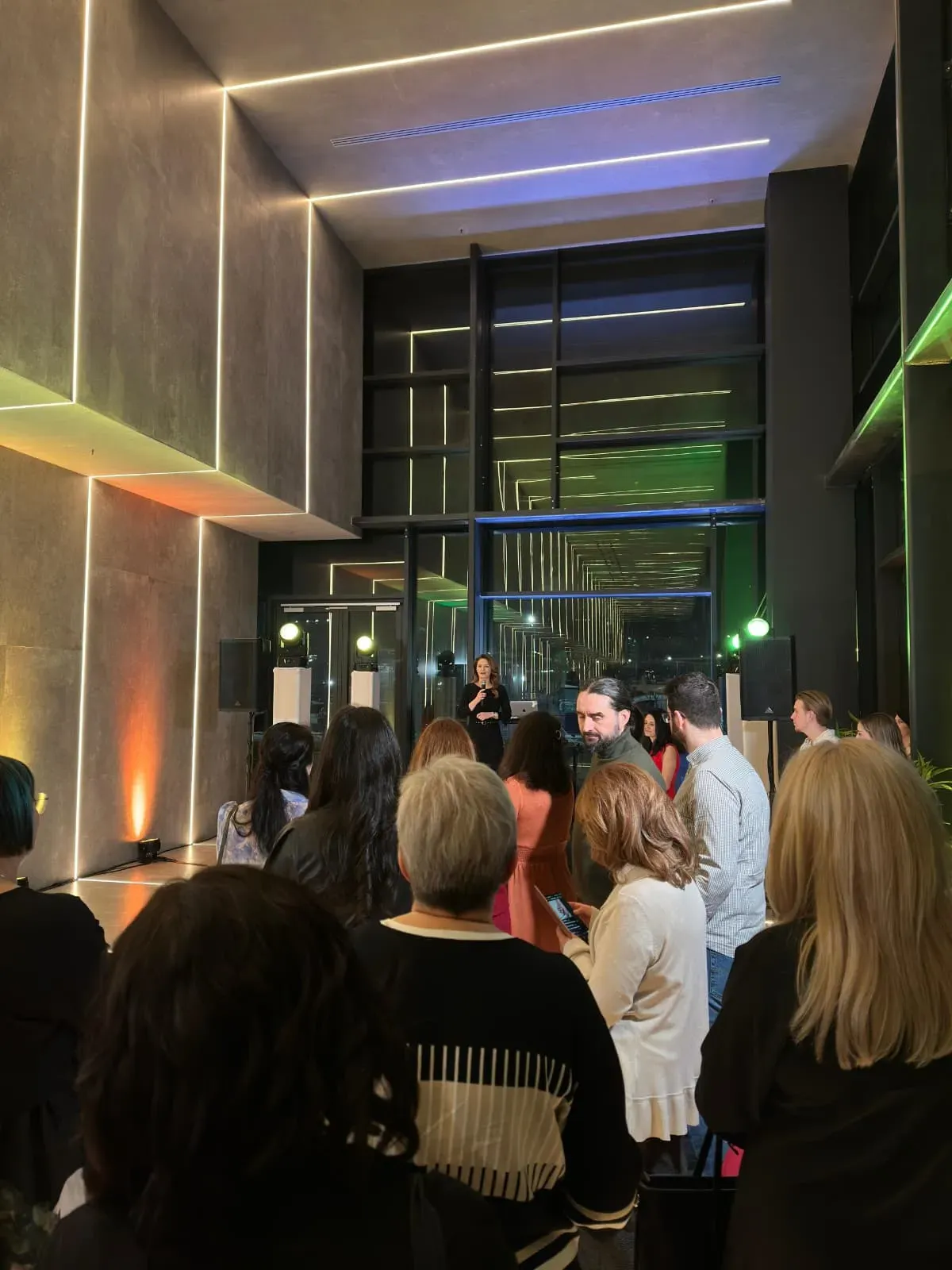 Guests gathered inside the illuminated Digestmed clinic during the launch event in Bucharest.