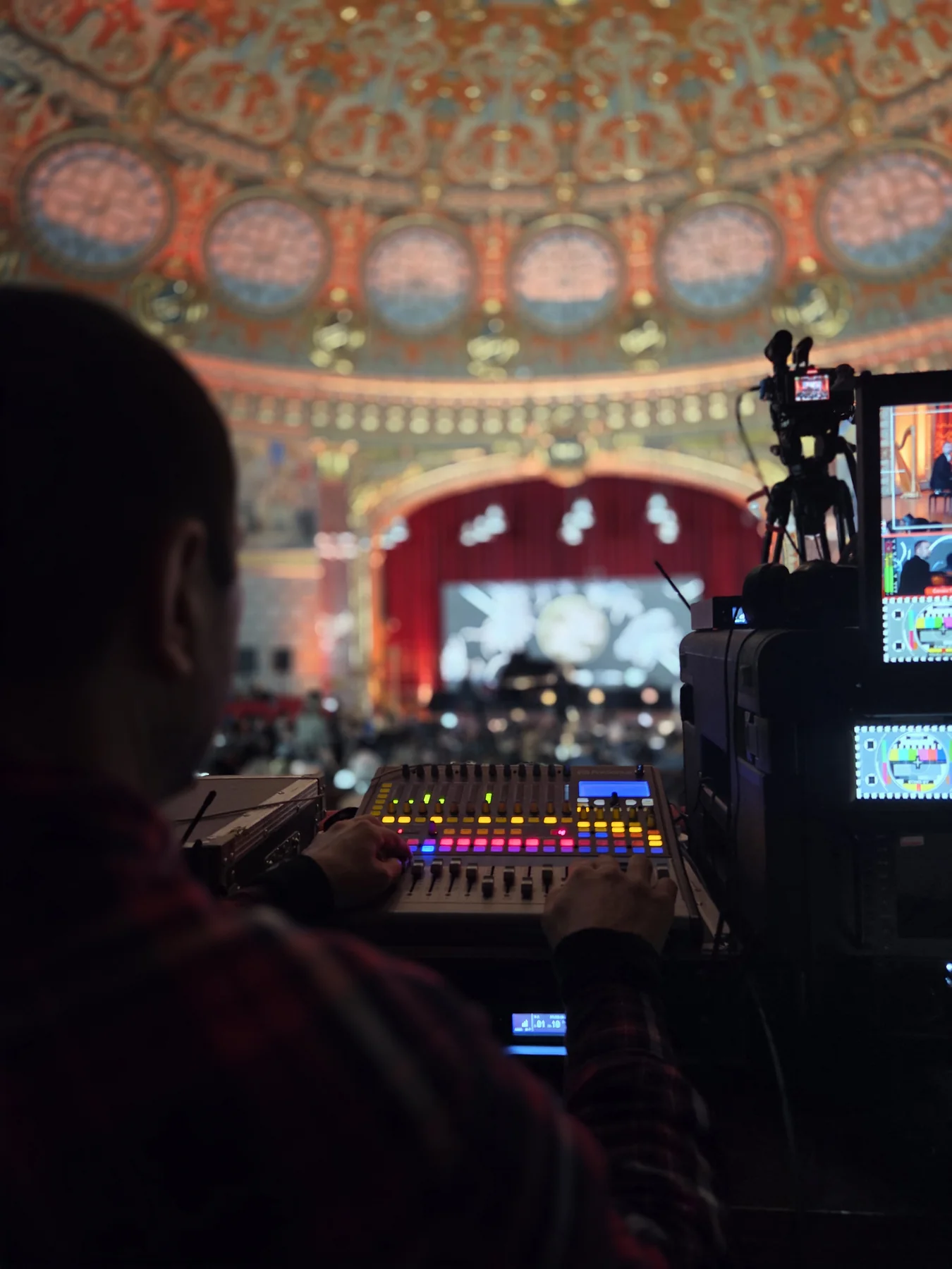 Camera and technical-control position facing the stage at the European Roma Institute event in the Romanian Athenaeum.