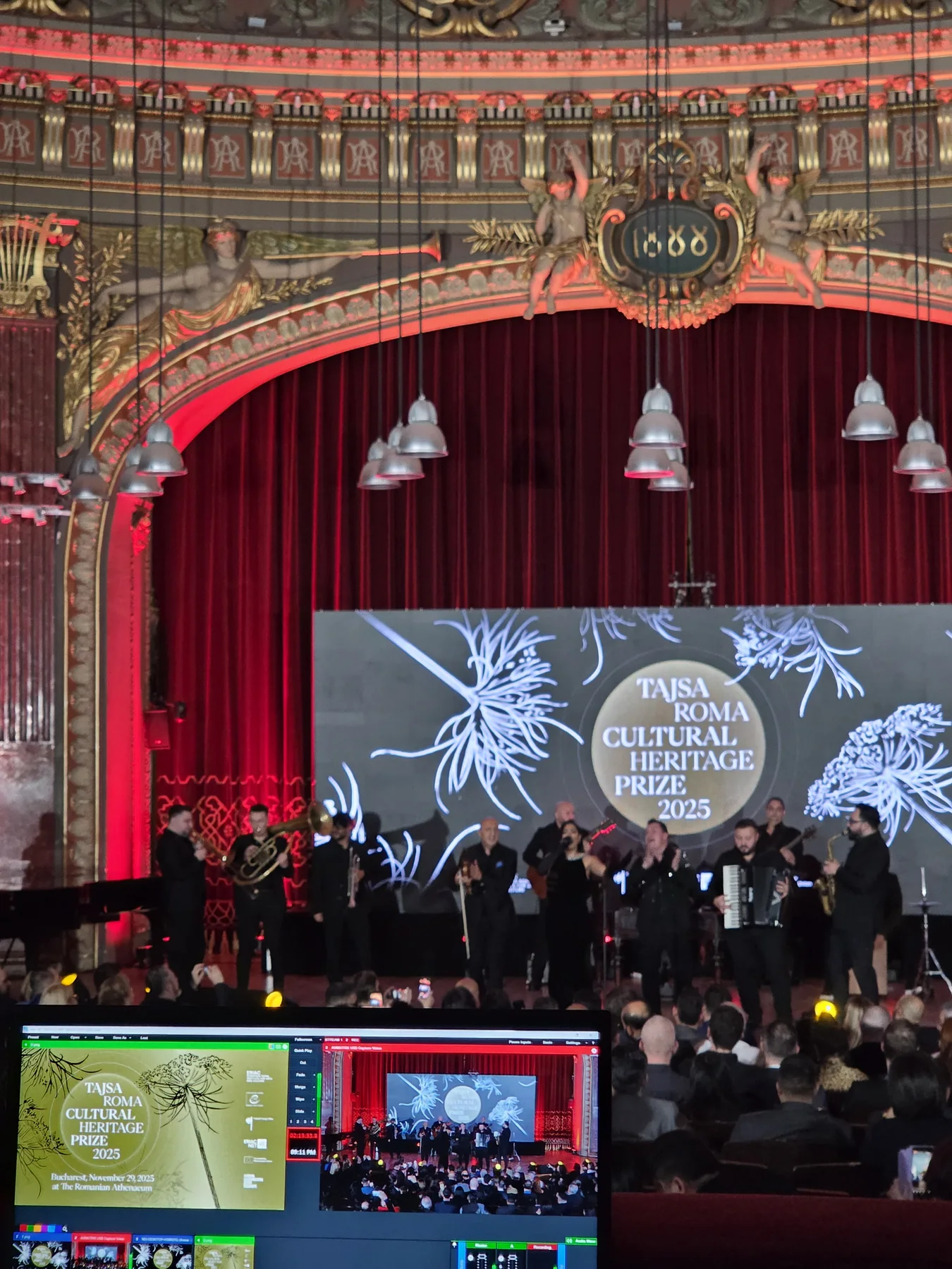 Group assembled on stage at the close of the European Roma Institute event in the Romanian Athenaeum.