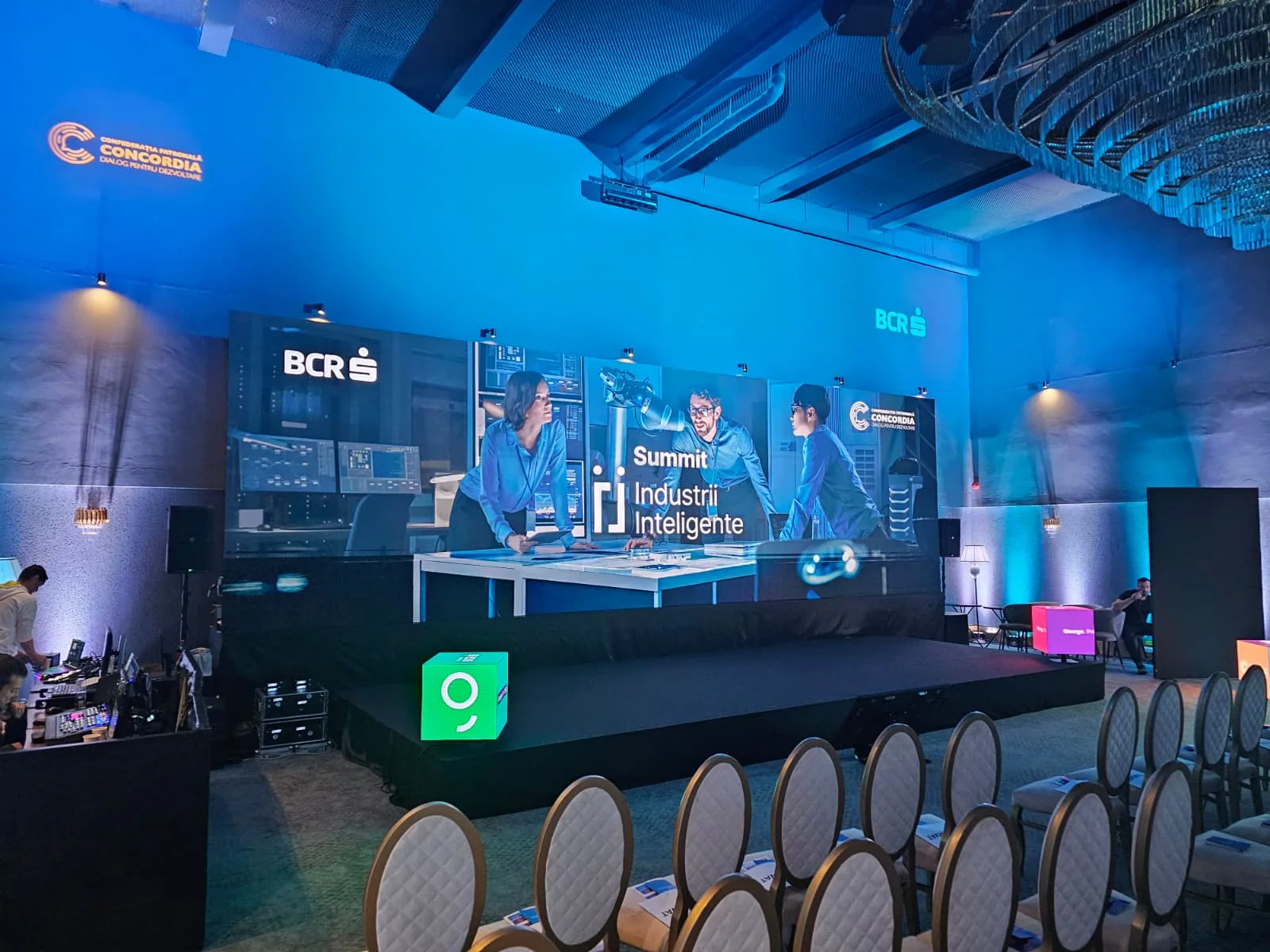 Wide view of the LED stage, branded content and event lighting before the Smart Industries Summit.