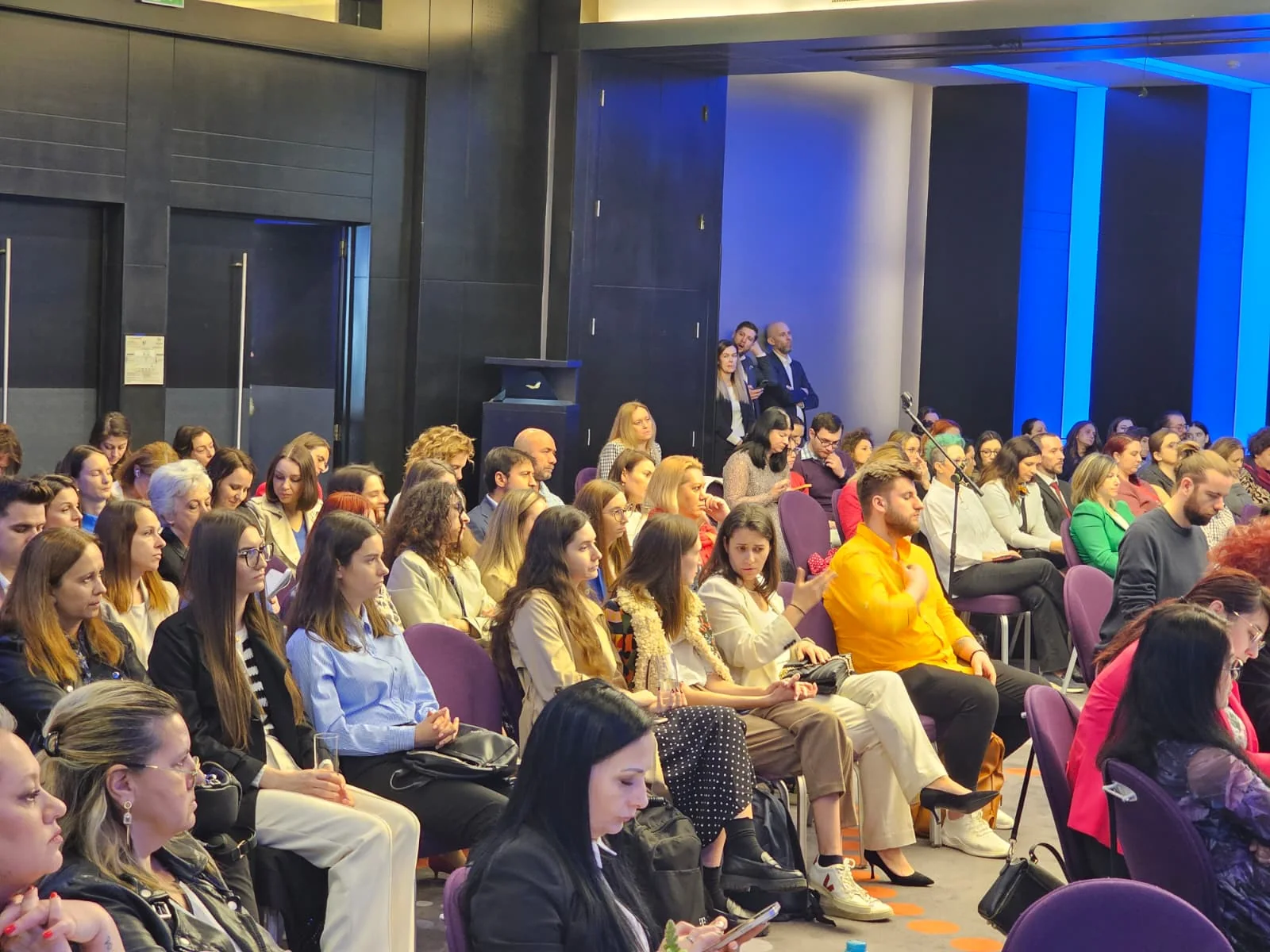 Audience at the HR 2.0 conference facing the stage at Sheraton Bucharest.