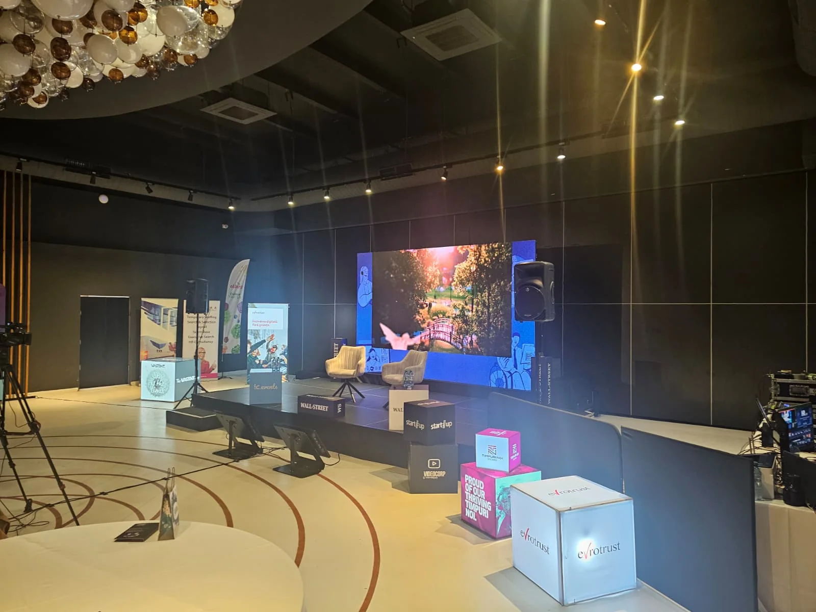 HR 2.0 event space with LED stage and branded cubes at Terra Events in Bucharest.