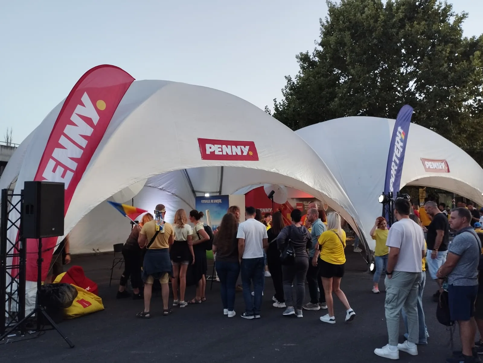 PENNY brand activation tent at Arena Nationala in Bucharest with visitors gathered outside the stadium.