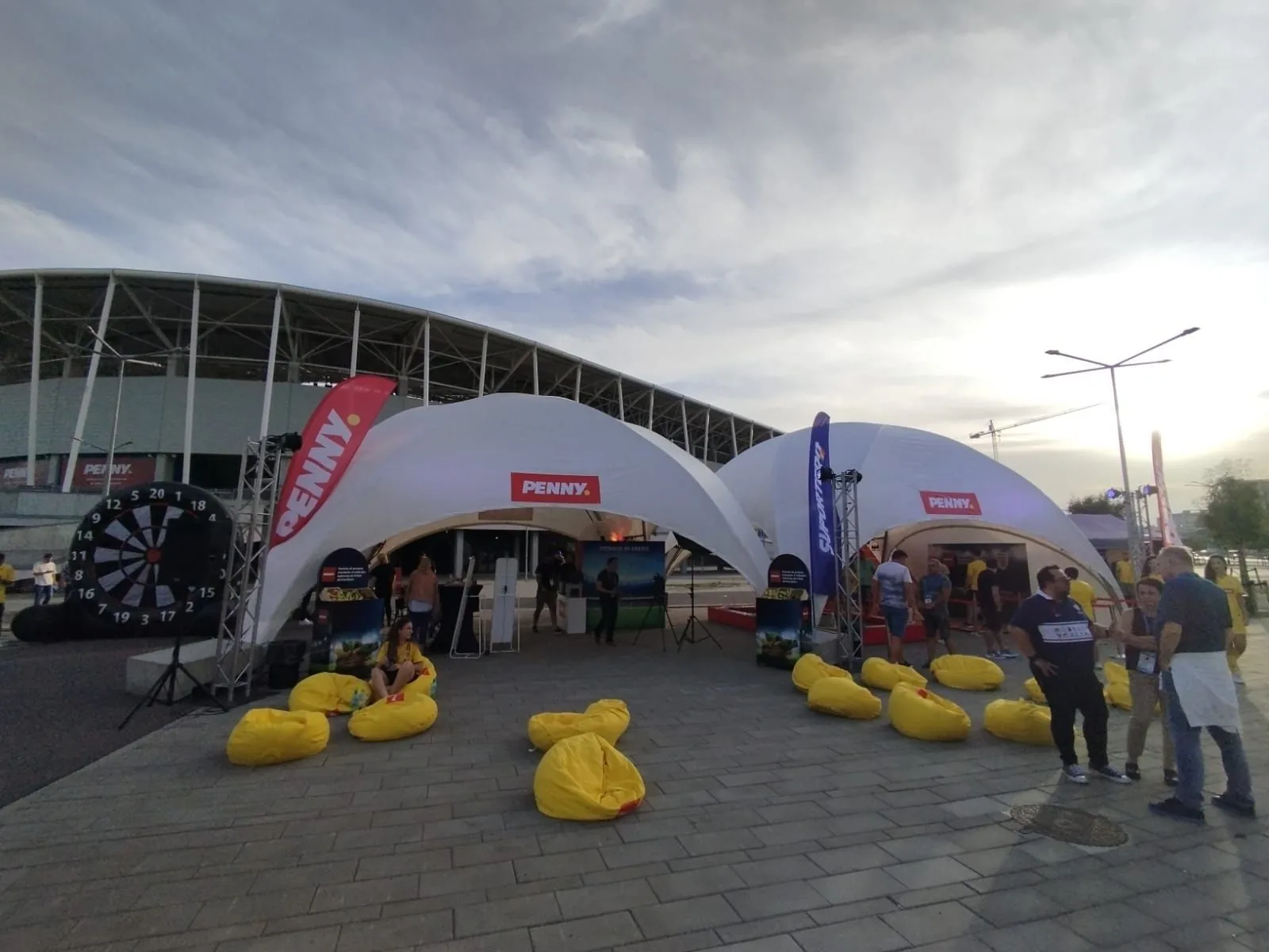 PENNY Ghencea Stadium activation with the branded tent, yellow beanbags and visitors outside the venue.