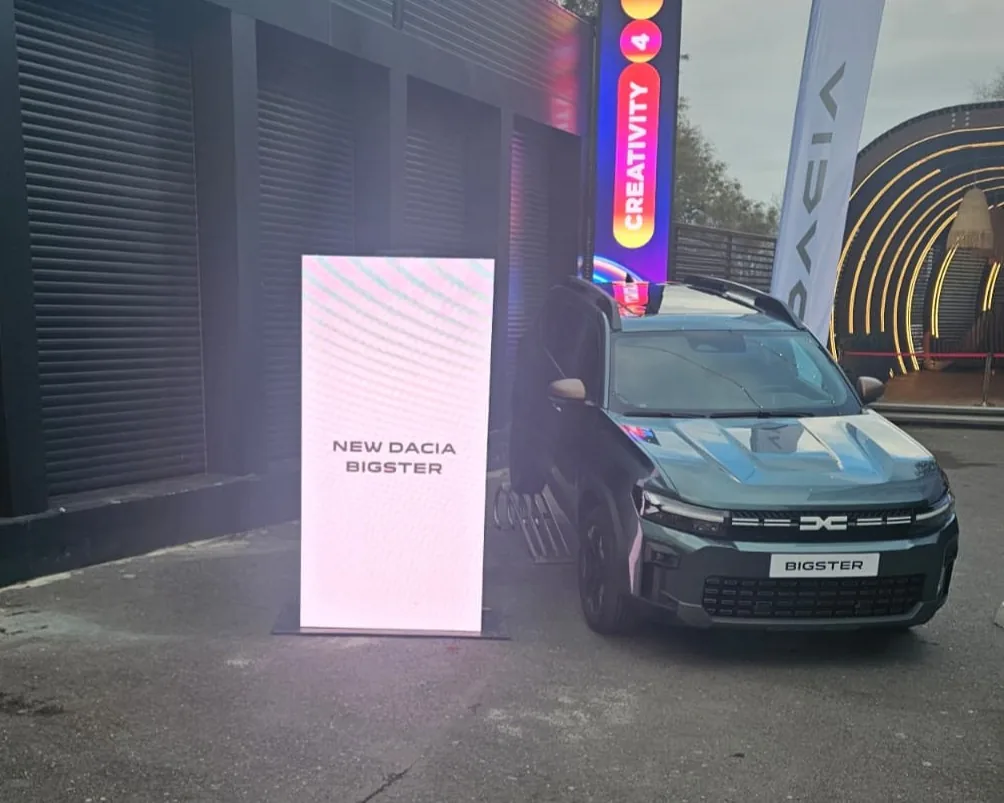 LED display beside a Dacia vehicle at the venue entrance for Dacia Club Face at Face Club in Bucharest.