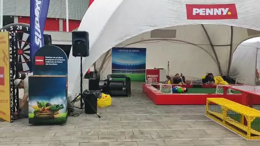 Video poster showing penny fan activation with branded dome and event display for Penny Romania-Wales at Ghencea Stadium in Bucharest.