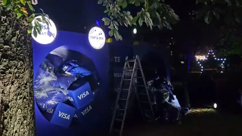 Visa-branded outdoor activation installation with event lighting at Untold Festival.