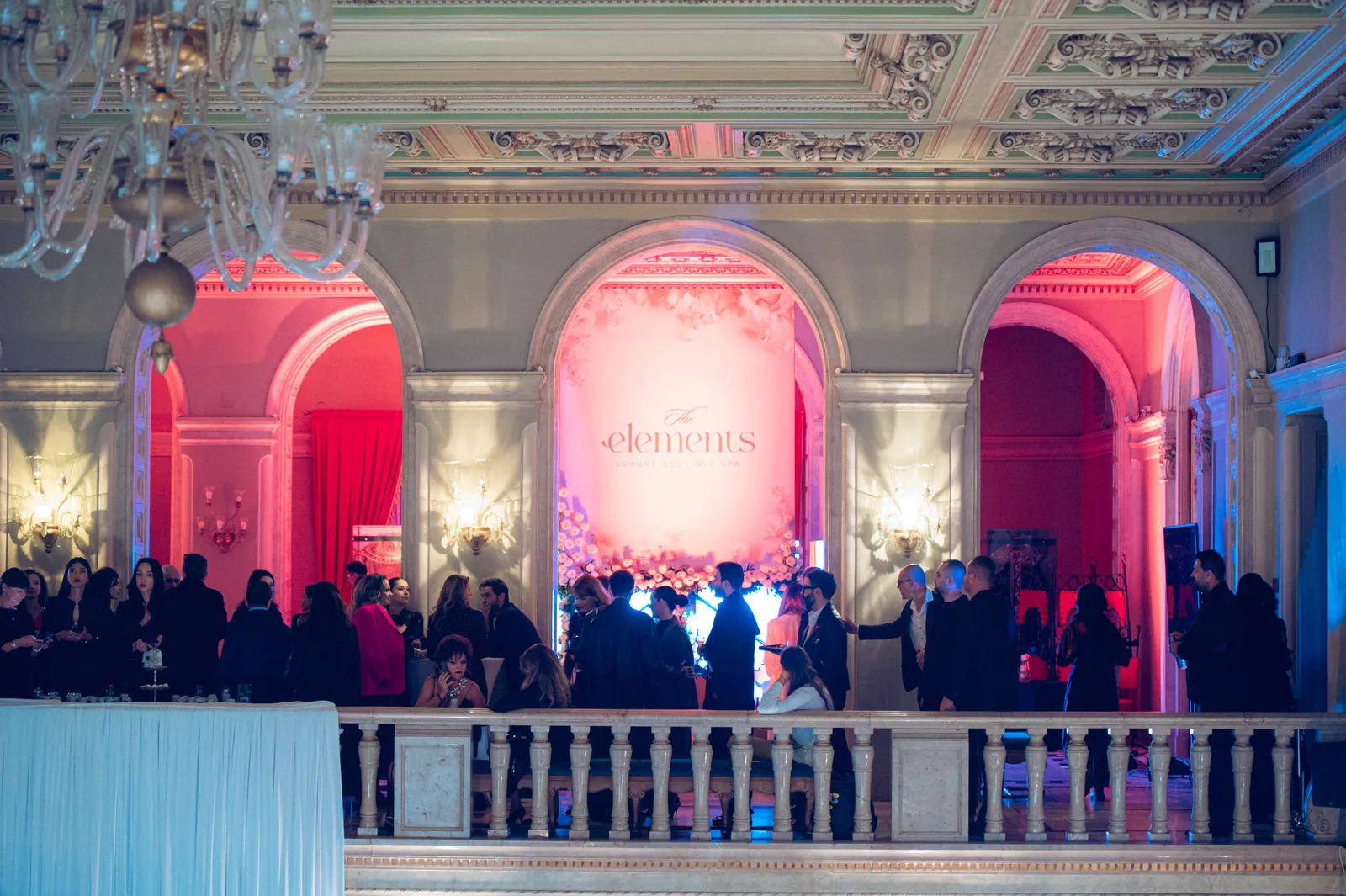The palace hall at Bucharest Fashion Week with the Elements backdrop and guests