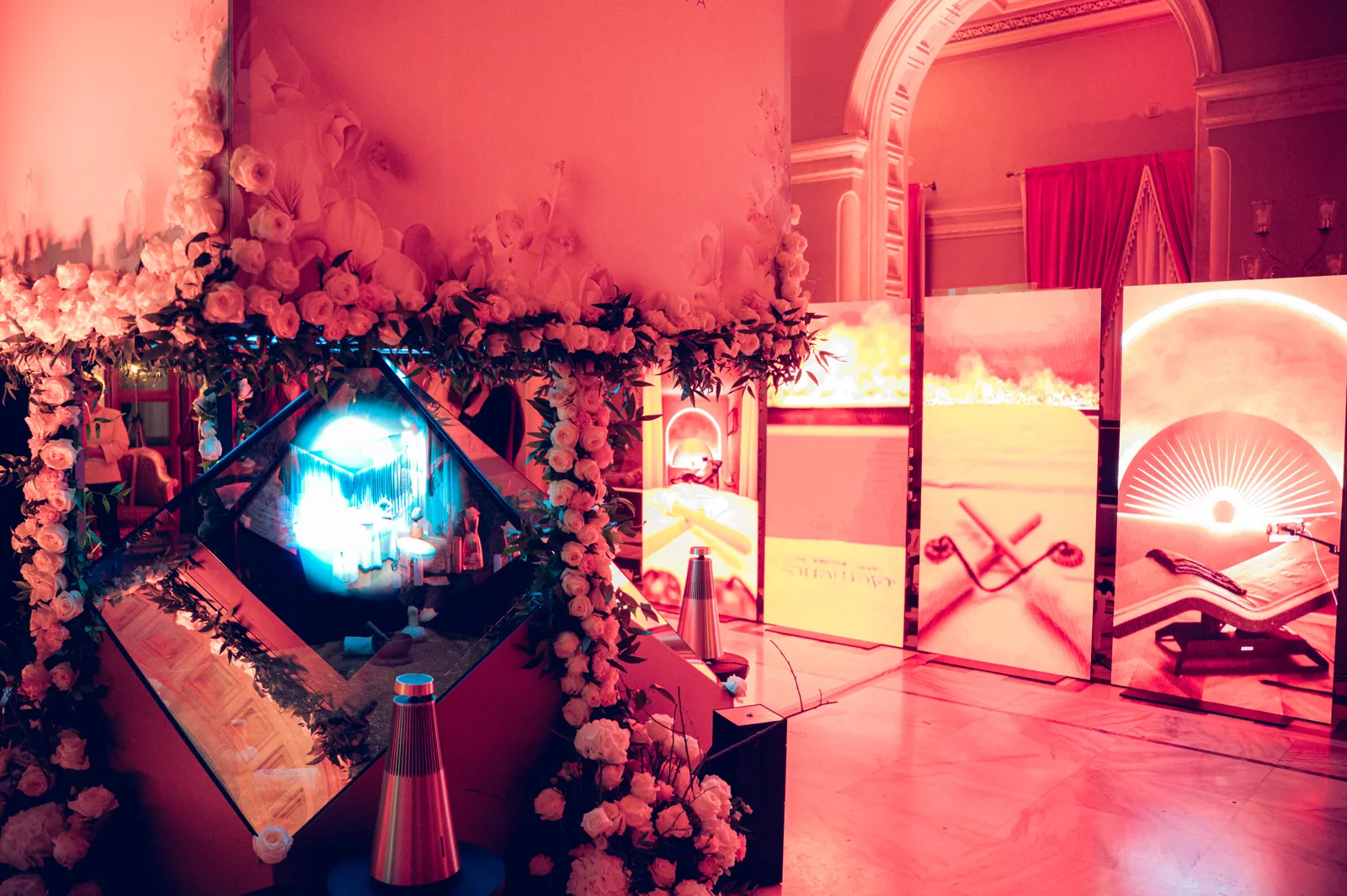White roses on the diamond with an LED screen showing Elements spa content