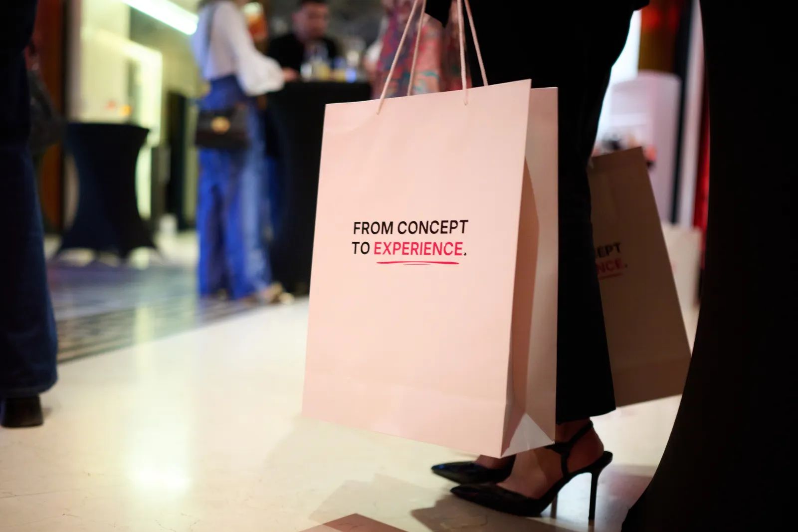 The gift bag carrying the tagline: From Concept to Experience
